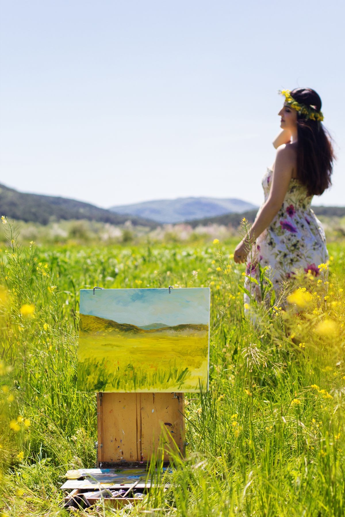 Young artist girl is create picture of an floral landscape, spring time Young artist girl is create picture of an floral landscape, spring time